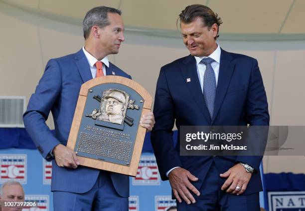 Trevor Hoffman is presented his plaque from Hall of Fame President Jeff Idelson at Clark Sports Center during the Baseball Hall of Fame induction...