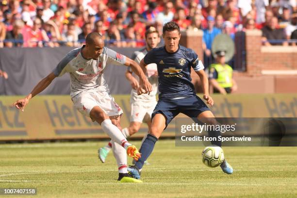 Liverpool Defender Fabinho passes the ball while pressured by Manchester United Forward Juan Mata in the ICC soccer match between Manchester United...