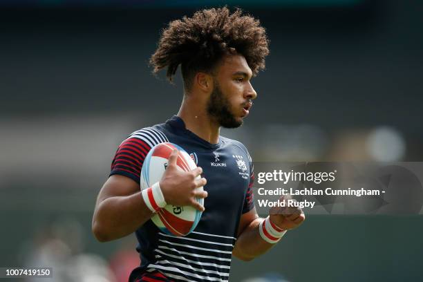 Max Denmark of Hong Kong runs away to score a try against Uruguay during day three of the Rugby World Cup Sevens at AT&T Park on July 22, 2018 in San...