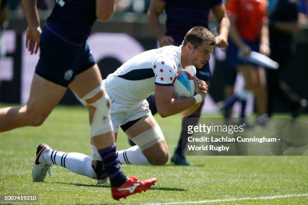 Bret Thompson of the United States crosses the try line to score against Scotland during day three of the Rugby World Cup Sevens at AT&T Park on July...