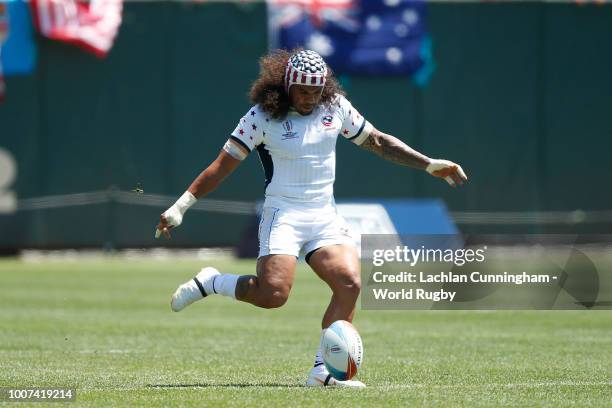 Folau Niua of the United States kicks the ball against Scotland during day three of the Rugby World Cup Sevens at AT&T Park on July 22, 2018 in San...