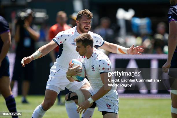 Stephen Tomasin of the United States celebrates with Bret Thompson after Thompson scored a try against Scotland during day three of the Rugby World...
