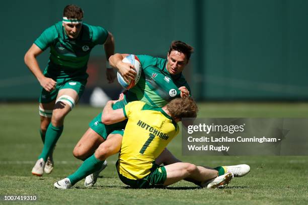 Billy Dardis of Ireland is tackled by Henry Hutchinson of Austalian during day three of the Rugby World Cup Sevens at AT&T Park on July 22, 2018 in...