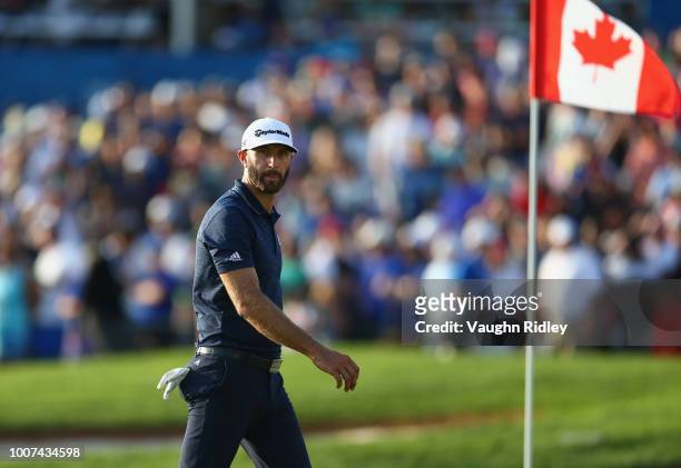 Dustin Johnson reacts to his putt on the 18th hole during the final round at the RBC Canadian Open at Glen Abbey Golf Club on July 29, 2018 in...