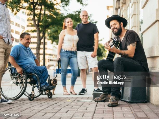 busking street musician - street musician stock pictures, royalty-free photos & images