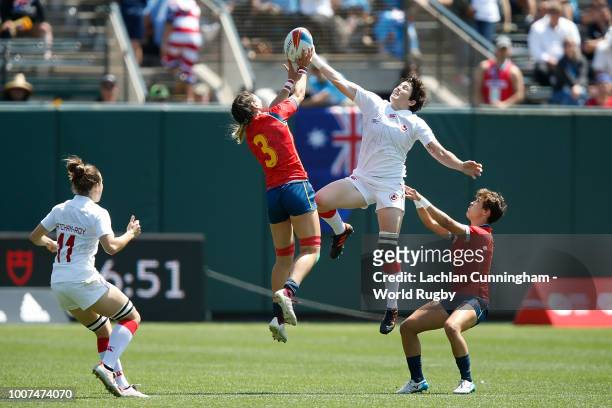 Brittany Benn of Canada competes for the ball against Amaia Erbina of Spain during day two of the Rugby World Cup Sevens at AT&T Park on July 21,...