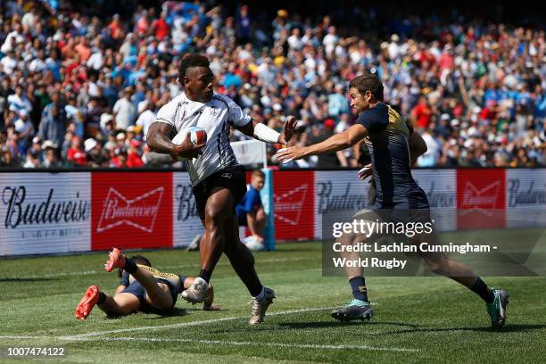 Josua Tuisova of Fiji evades Franco Sabato of Argentina during their match on day two of the Rugby World Cup Sevens at AT&T Park on July 21, 2018 in...