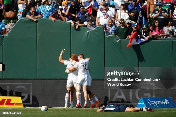 England players celebrate after scoring the match winning try against the United States in their quarter final match during day two of the Rugby...