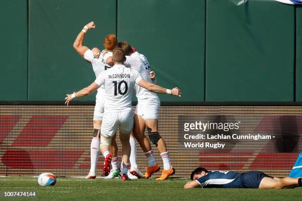 England players celebrate after scoring the match winning try against the United States in their quarter final match during day two of the Rugby...