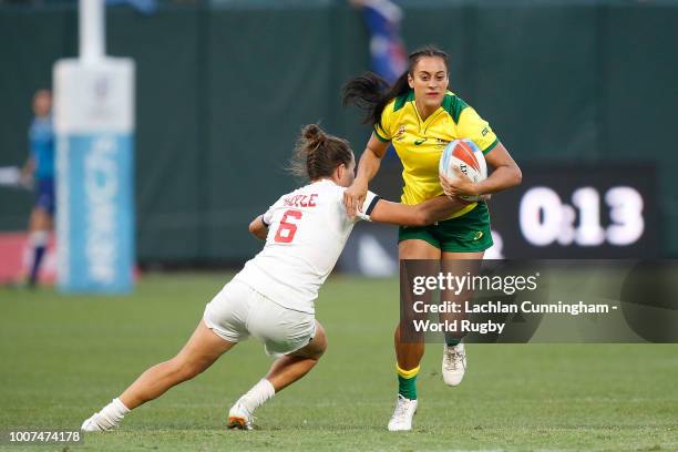 Yasmin Meakes of Australia is tackled by Lauren Doyle of the United States during day two of the Rugby World Cup Sevens at AT&T Park on July 21, 2018...