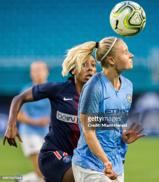 Mie Jans , front, clears the ball with a header as Ashley Lawrence , back, tries to steal the ball during the third place match of the Women's...