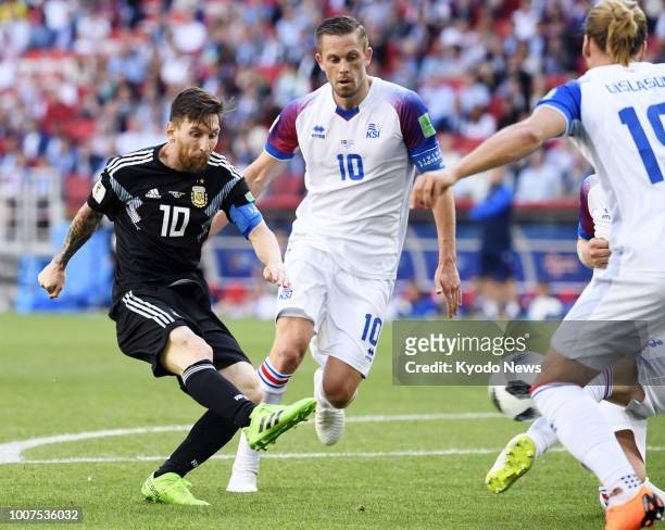 Lionel Messi of Argentina kicks the ball past Gylfi Sigurdsson of Iceland at the end of a World Cup group-stage match at Spartak Stadium in Moscow on...