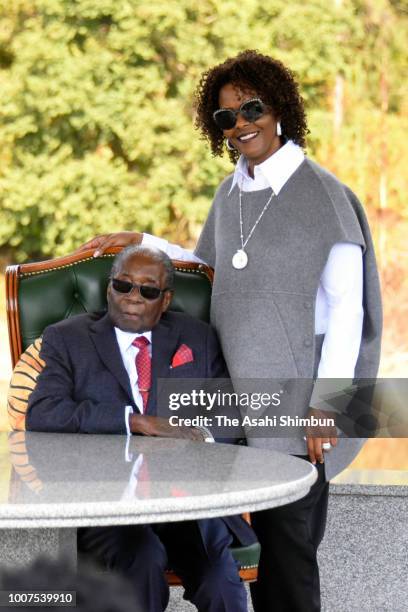 Former President Robert Mugabe and his wife Grace pose for photographs after a press conference ahead of the election on July 29, 2018 in Harare,...