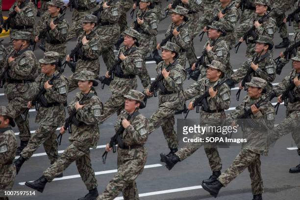 Peruvian officers seen participating in the military parade. Members of Peru's armed forces, coastguard, search & rescue, and police march in full...