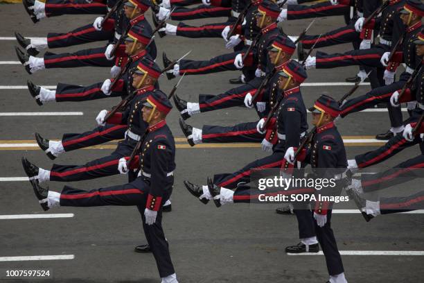 Peruvian officers seen participating in the military parade. Members of Peru's armed forces, coastguard, search & rescue, and police march in full...