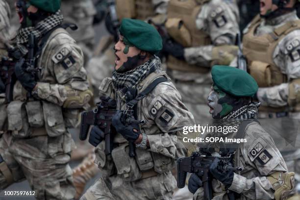 Peruvian officers seen participating in the military parade. Members of Peru's armed forces, coastguard, search & rescue, and police march in full...