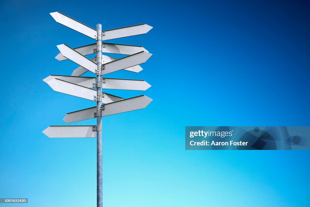 A 3D pole with blank street signs pointing all directions