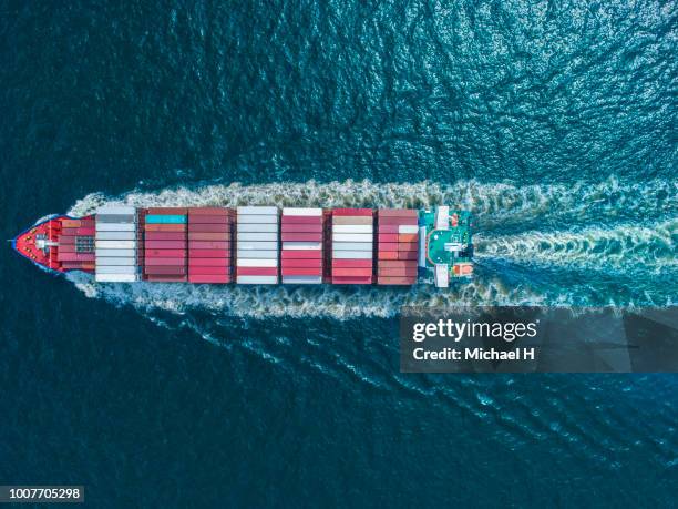 aerial view of  container ship in sea - ship above stock pictures, royalty-free photos & images