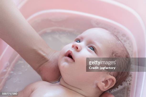 baby in the bath - taking a bath stock pictures, royalty-free photos & images