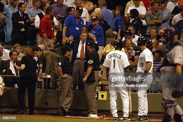 Comissioner Bud Selig confers with the game umpires in the 11th inning during the MLB All Star Game July 9, 2002 at Miller Park in Milwaukee,...