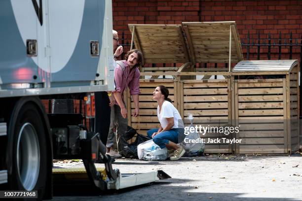 Boris Johnson's wife, Marina Wheeler, and son Milo take out rubbish as removal men remove belongings from the Foreign Secretary's grace-and-favour...