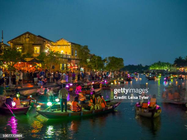 Tourists on the Thu Bon River in Hoi An's old quarter during the Lantern Festival. A trading port from the 15th to the 19th century, then known as...