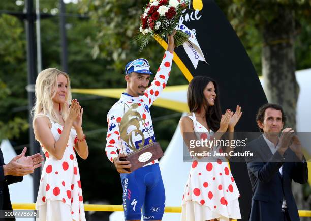 Julian Alaphilippe of France and Quick Step Floors, winner of polka dot jersey for best climber receives the trophy from CEO of Carrefour Alexandre...