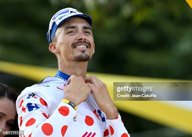 Julian Alaphilippe of France and Quick Step Floors, winner of polka dot jersey for best climber during the podium ceremony following stage 21 of Le...