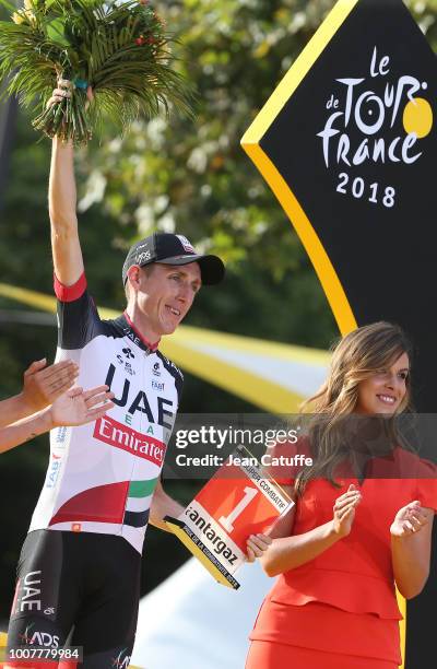 Dan Martin of Ireland and UAE Team Emirates receives the award for most agressive rider of the Tour during the podium ceremony following stage 21 of...