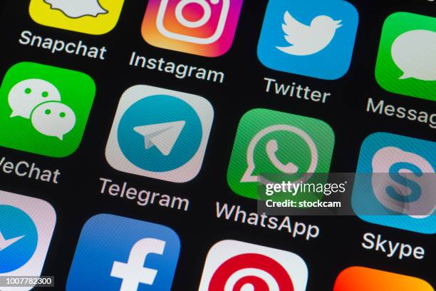 telegram, whatsapp, skype and other phone apps on iphone screen - brand name online messaging platform stock pictures, royalty-free photos & images