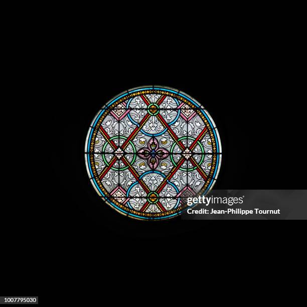 circular stained glass window of the church of carolles, normandy, france - rosettfönster bildbanksfoton och bilder