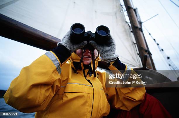 sailor looking through binoculars - sailing navigation stock pictures, royalty-free photos & images
