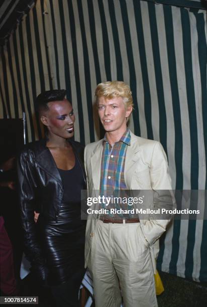 David Bowie with Grace Jones after his triumph at he Hippodrome d'Auteuil, in the Paris suburbs, 8th June 1983