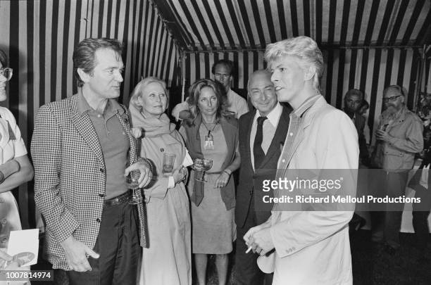 David Bowie with Philippe Labro, Michele Morgan, Danielle Thompson and Gerard Oury after his triumph at he Hippodrome d'Auteuil, in the Paris...
