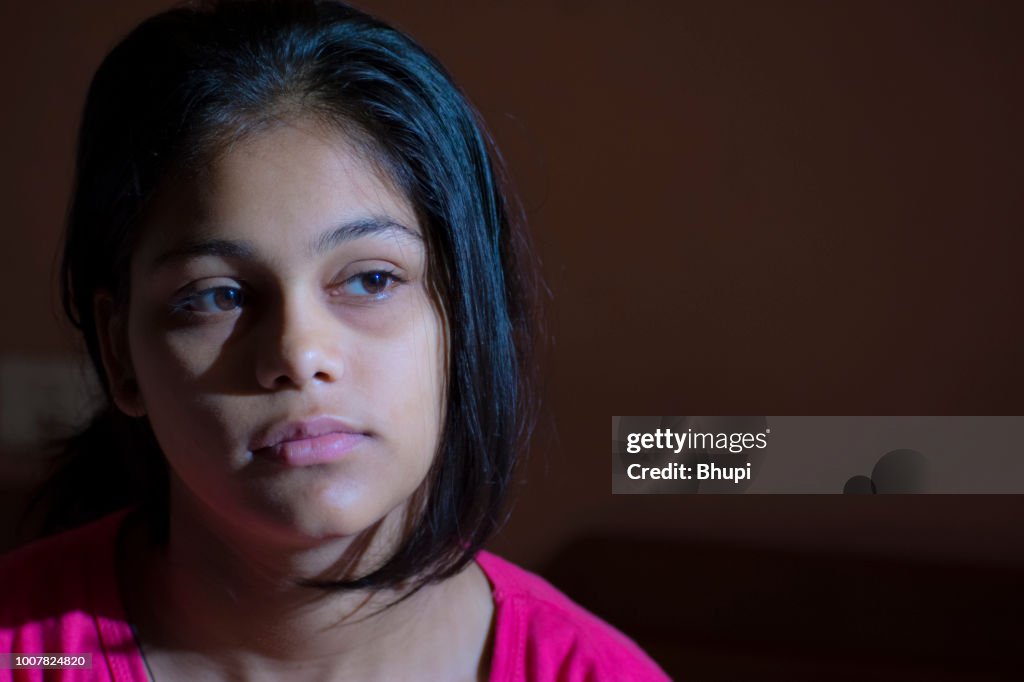 Portrait of rural Indian smiling girl, looking at camera