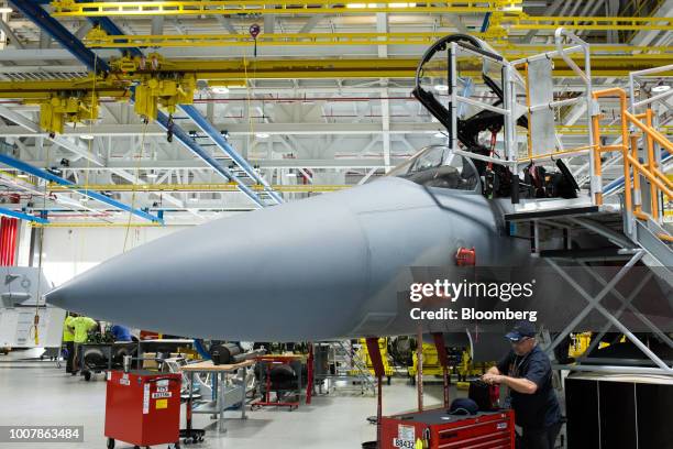 Worker performs quality checks on a Boeing Co. F/A-18 Super Hornet fighter aircraft at the Boeing Defense, Space & Security facility in St. Louis,...