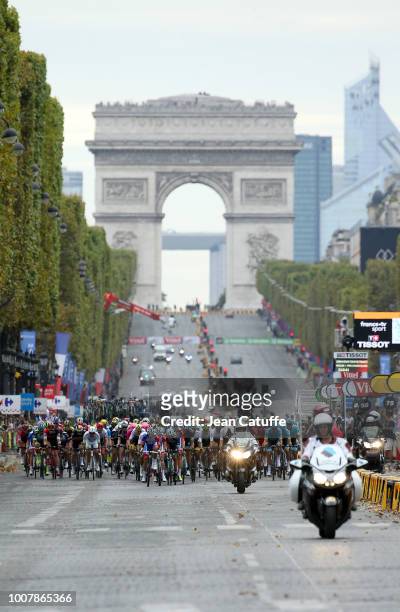 The pack riding on the Champs Elysees avenue following stage 21 of Le Tour de France 2018 between Houilles and Paris, avenue des Champs-Elysees on...