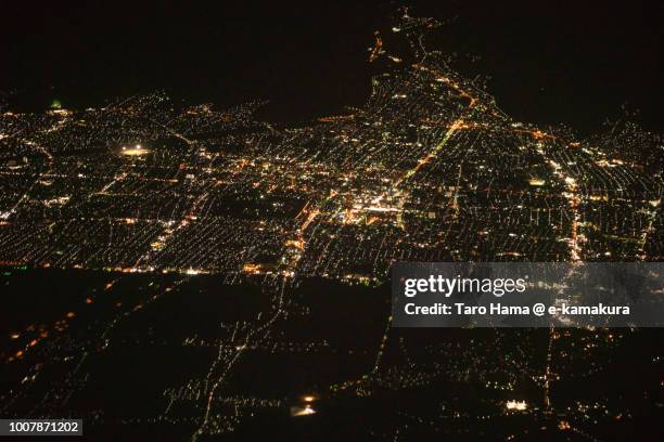 yamagata city in yamagata prefecture in japan night time aerial view from airplane - yamagata prefecture foto e immagini stock