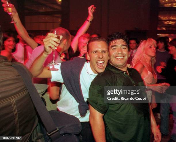 Fan smiles and hugs Diego Maradona during a party at the Conrad Hotel on January 09, 1999 in Punta del Este, Uruguay.