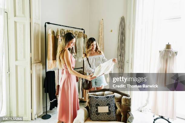 female friends shopping together in boutique - luxury apparel bildbanksfoton och bilder