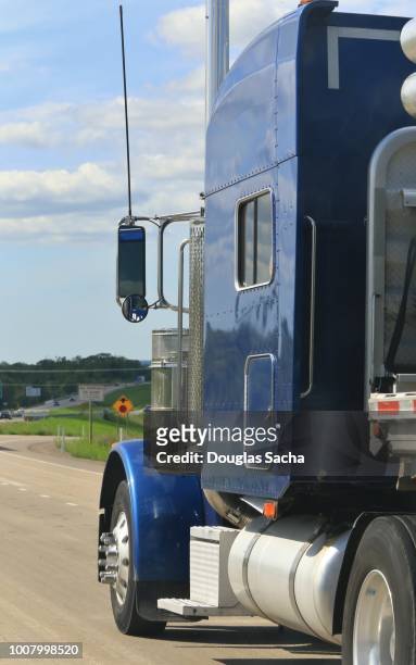 side view of a semi tractor truck on a rural highway - truck side view stock pictures, royalty-free photos & images