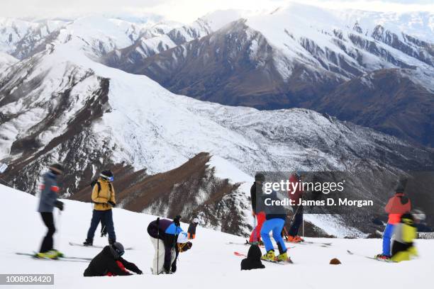 Group of skiers at the summit at Coronet Peak on July 31, 2018 in Queenstown, New Zealand. Coronet Peak is a ski field In Queenstown, on the South...