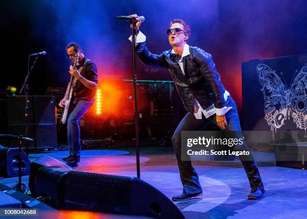 Robert DeLeo and Jeff Gutt of Stone Temple Pilots perform at Michigan Lottery Amphitheatre on July 24, 2018 in Sterling Heights, Michigan.