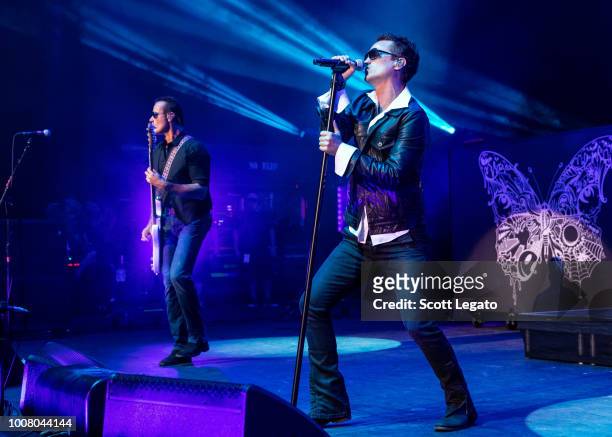 Robert DeLeo and Jeff Gutt of Stone Temple Pilots perform at Michigan Lottery Amphitheatre on July 24, 2018 in Sterling Heights, Michigan.