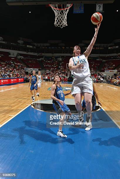 Katie Smith of the Minnesota Lynx lays a shot up during the game against the Washington Mystics on July 3, 2002 at Target Center in Minneapolis,...