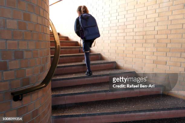 school girl walking up stairs to classroom - new zealand schools stock pictures, royalty-free photos & images