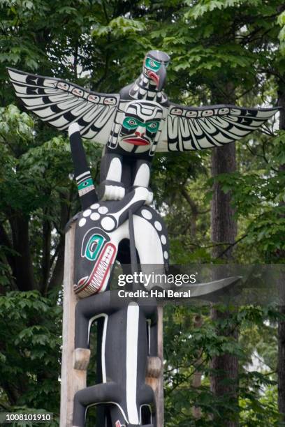 thunderbird and killer whale close-up on totem pole - native thunderbird stock pictures, royalty-free photos & images