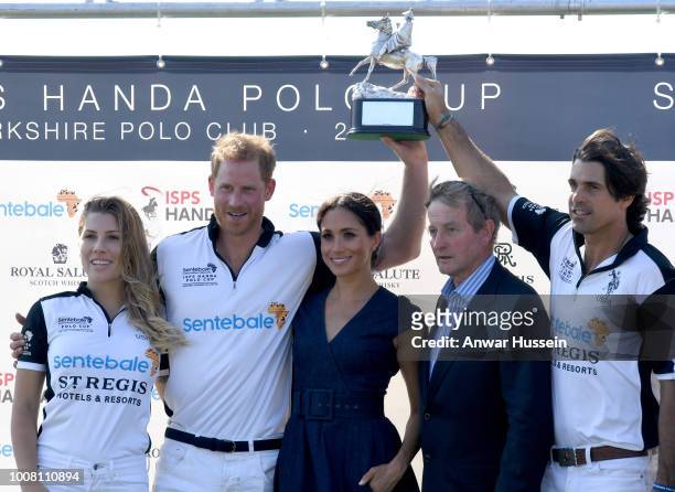 Ashley van Metre Busch, Prince Harry Duke of Sussex, Meghan Duchess of Sussex, Enda Kenny and Nacho Figuares pose with the Sentebale Polo 2018 trophy...
