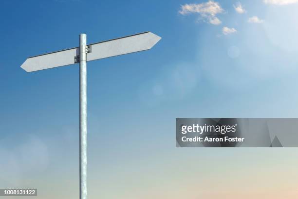 a 3d pole with blank street signs pointing all directions - 道しるべ ストックフォトと画像
