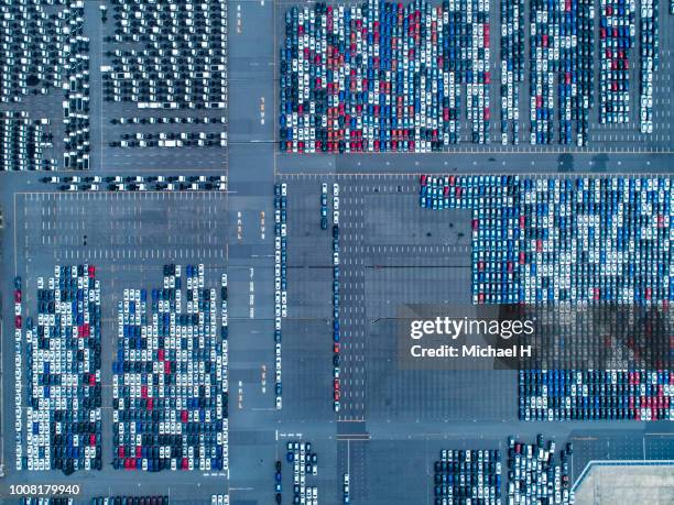 large number of cars at parking lot - cars parked in a row stock pictures, royalty-free photos & images